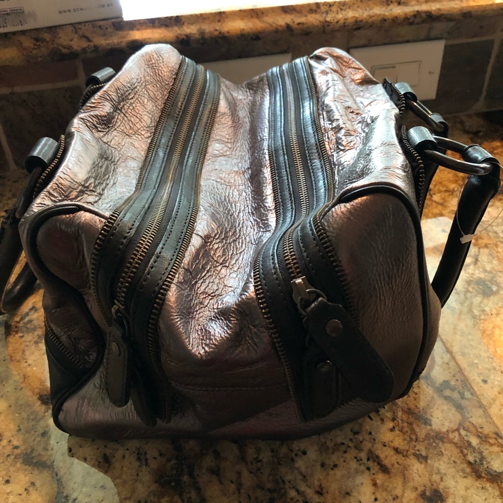 BCBG pewter and black metallic bag never used